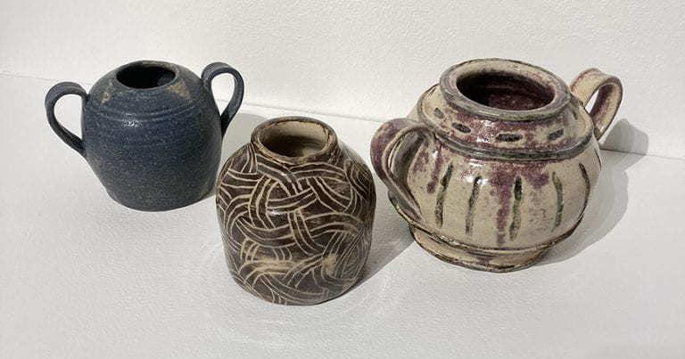 Three ceramic handled pots